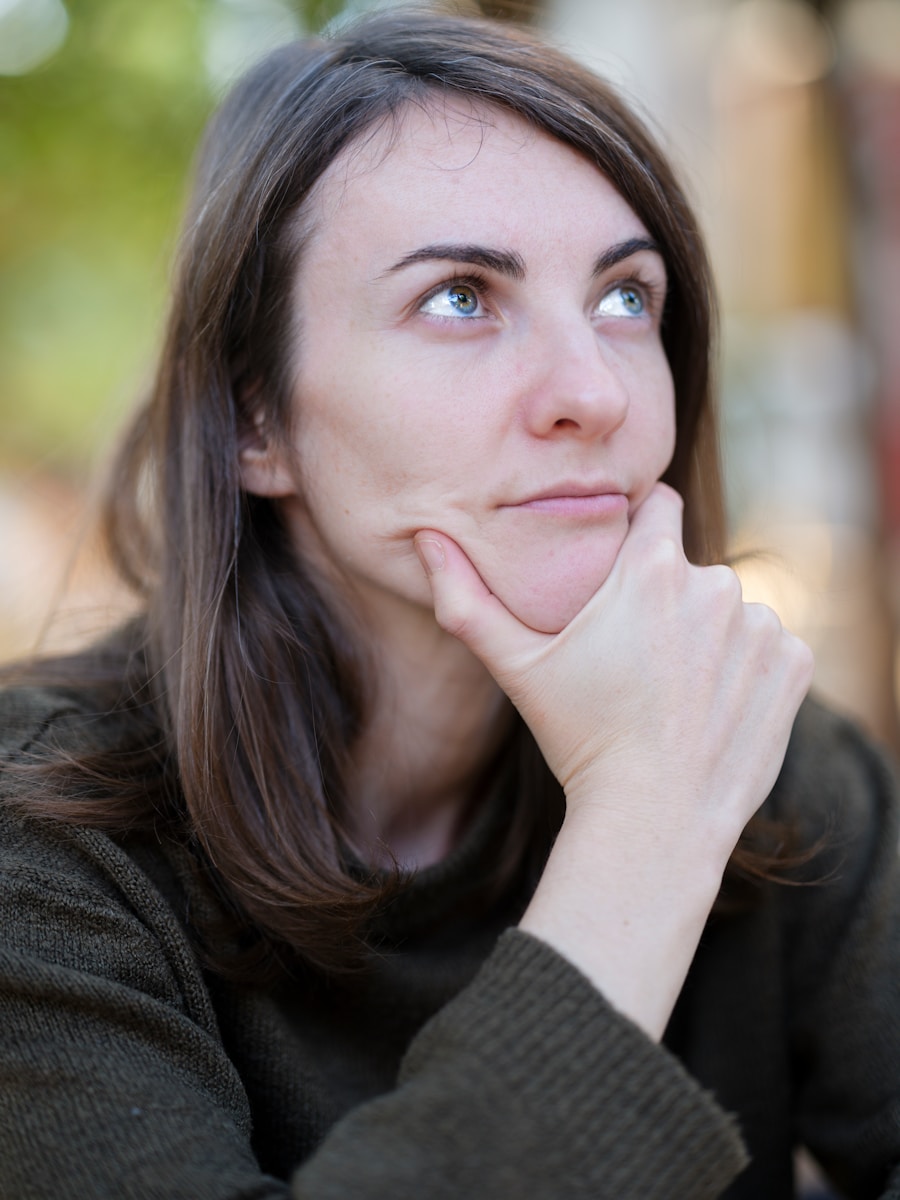 a woman with her chin resting on her hand thinking about Things That May Be Missing From her Homeowners Insurance Policy